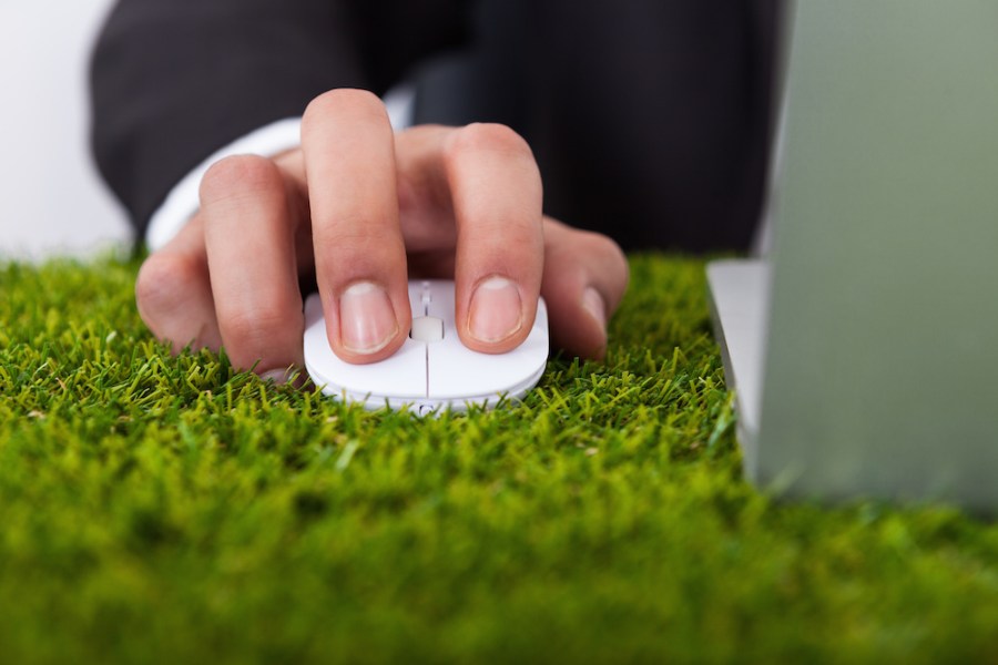 Businessman Using Laptop With Computer Mouse